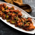 Chilli-chicken in white plate