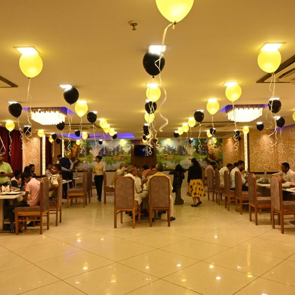 People eating in the dining hall of Jharokha restaurant