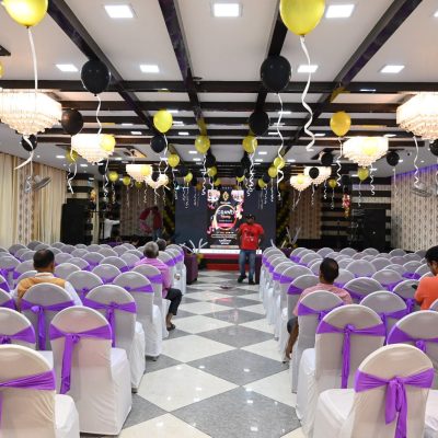 A seminar is conducted in a seminar hall by a man